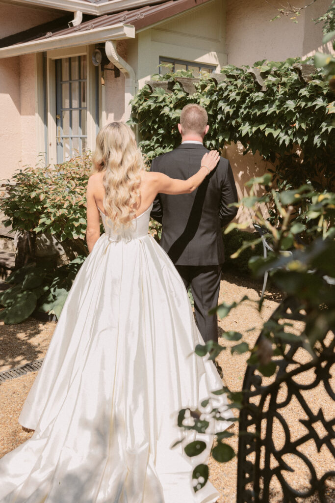 Bride and groom first look in garden