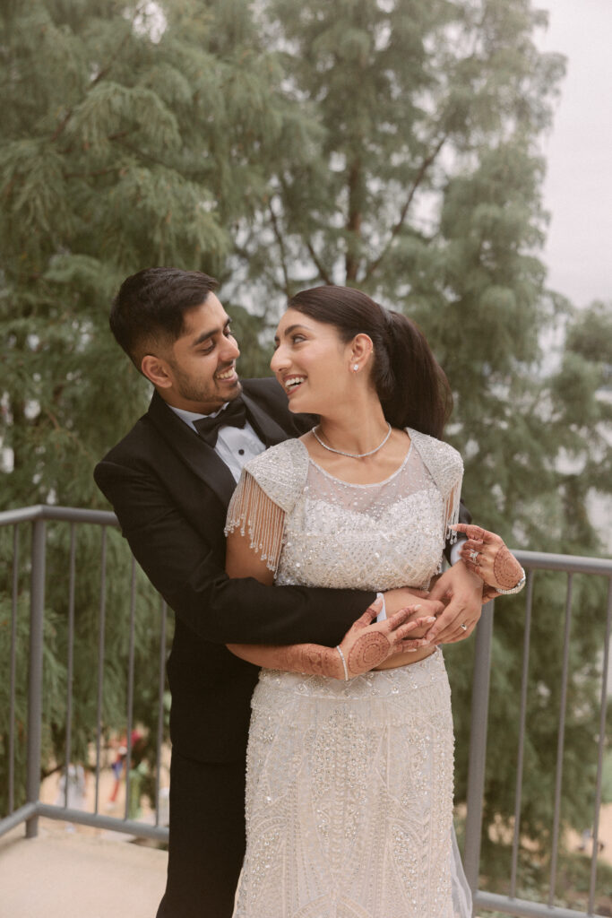 South Asian couple poses for portraits