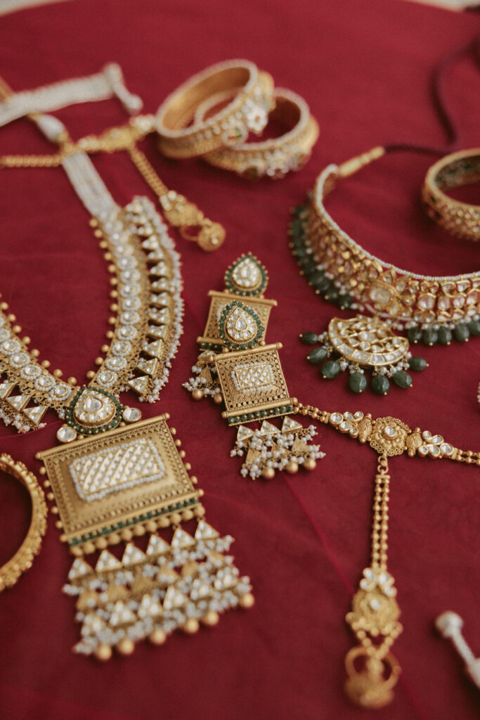 South Asian wedding flatlay detailing brides beautiful gold jewelry