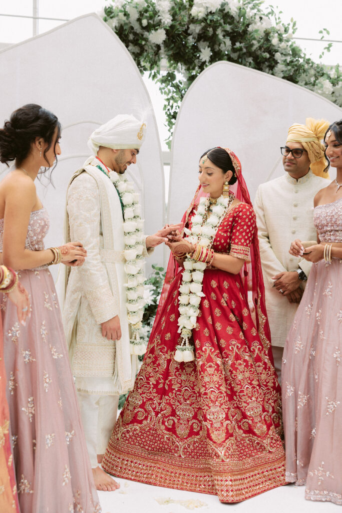 Indian couple exchanges rings during their wedding ceremony